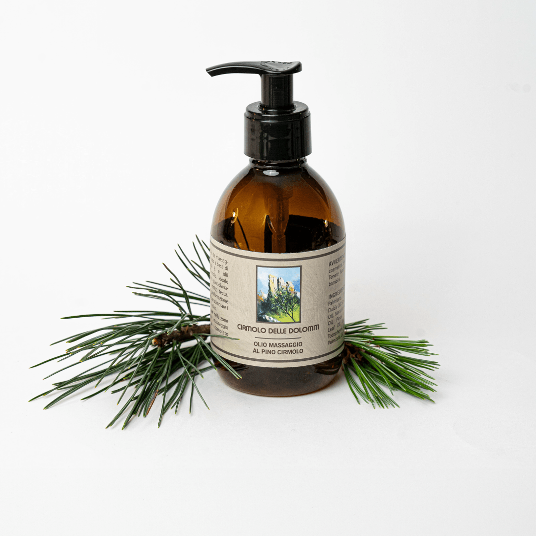 Flacone di olio da massaggio al pino cirmolo con rametto di pino